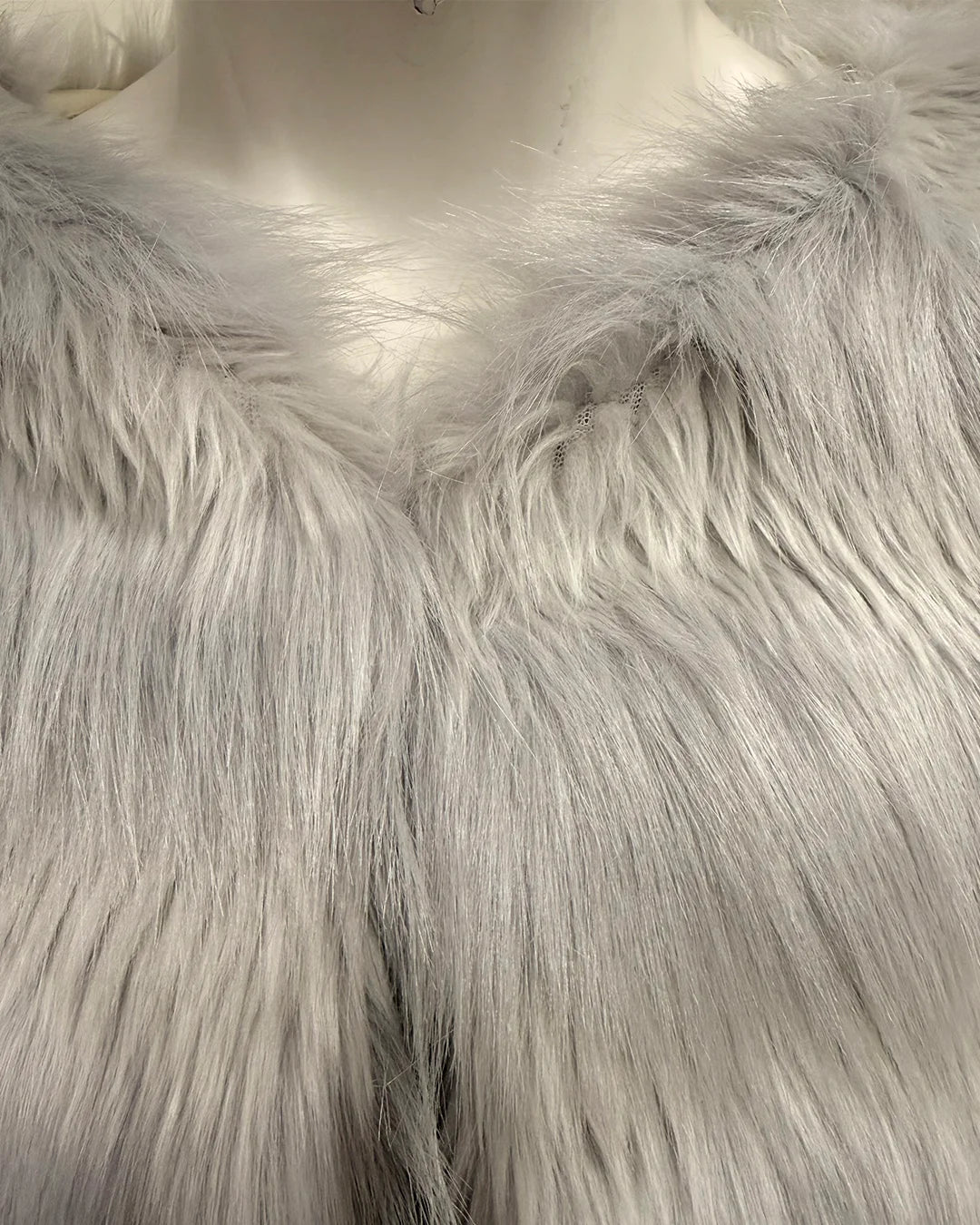 Close-up of a fluffy white fake fur on a mannequin