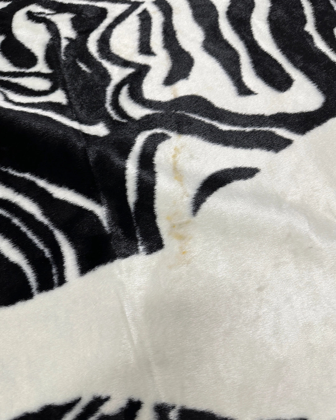 Close-up of zebra print faux fur rug with a soft texture