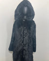 Black faux fur coat on a mannequin against a white background.