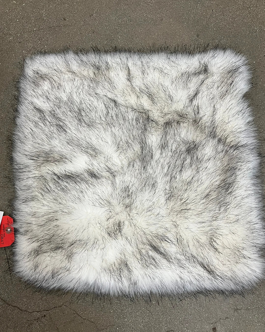 17x17 faux fur pillow with a white fake fur base with black tips giving a husky faux fur look.