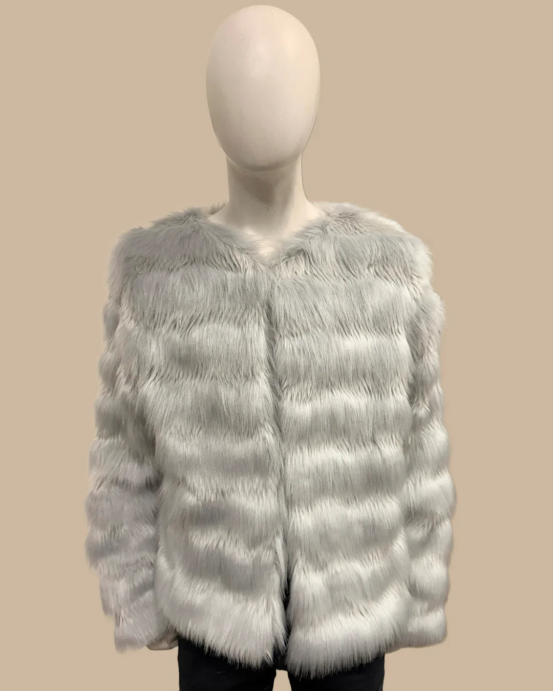 Mannequin wearing a light gray fake fur jacket on a beige background