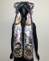 Colorful faux fur SpiritHood with animal ears on a mannequin against a plain background