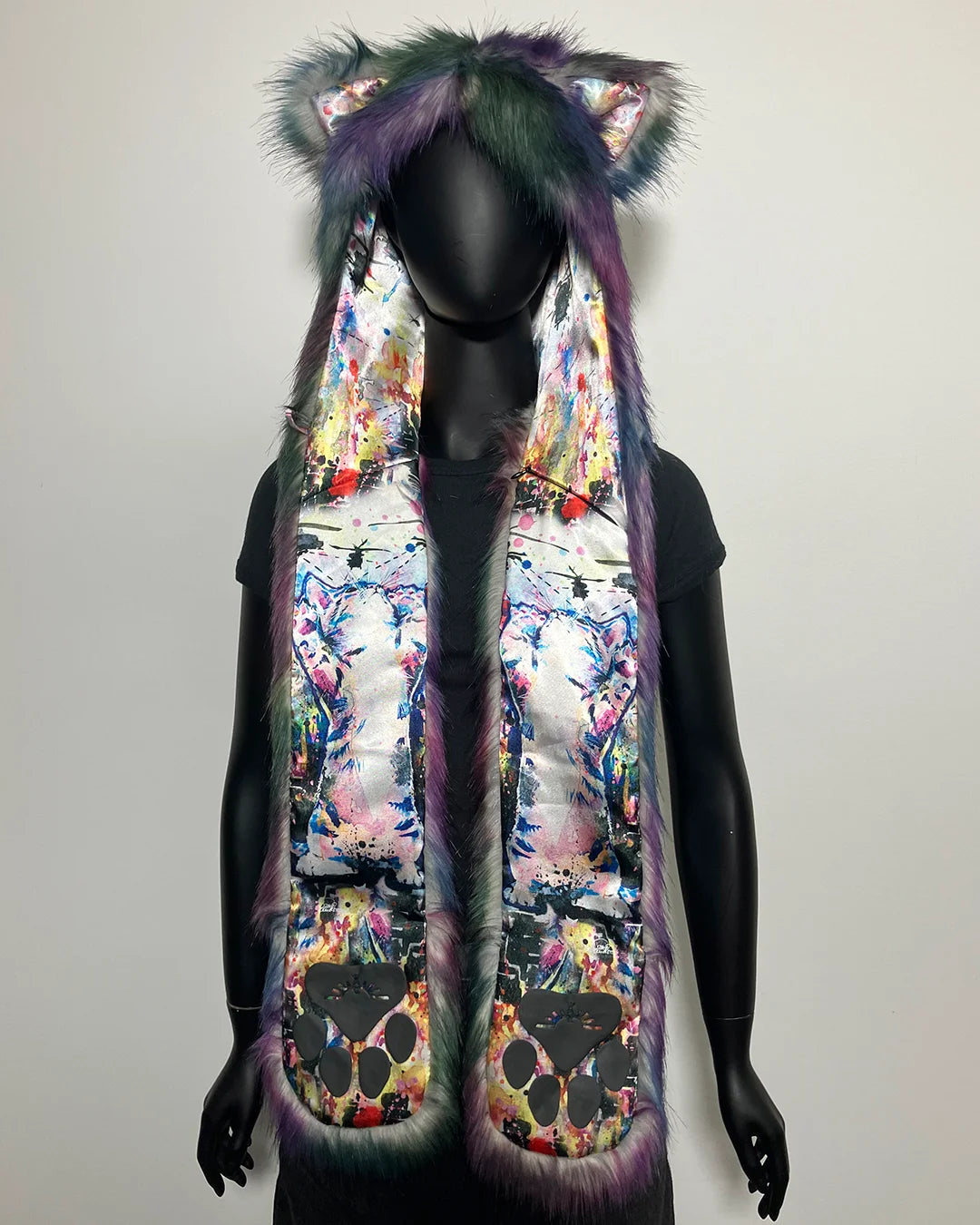 Colorful faux fur SpiritHood with animal ears on a mannequin against a plain background
