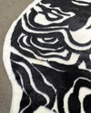 Close-up of a black and white patterned rug  