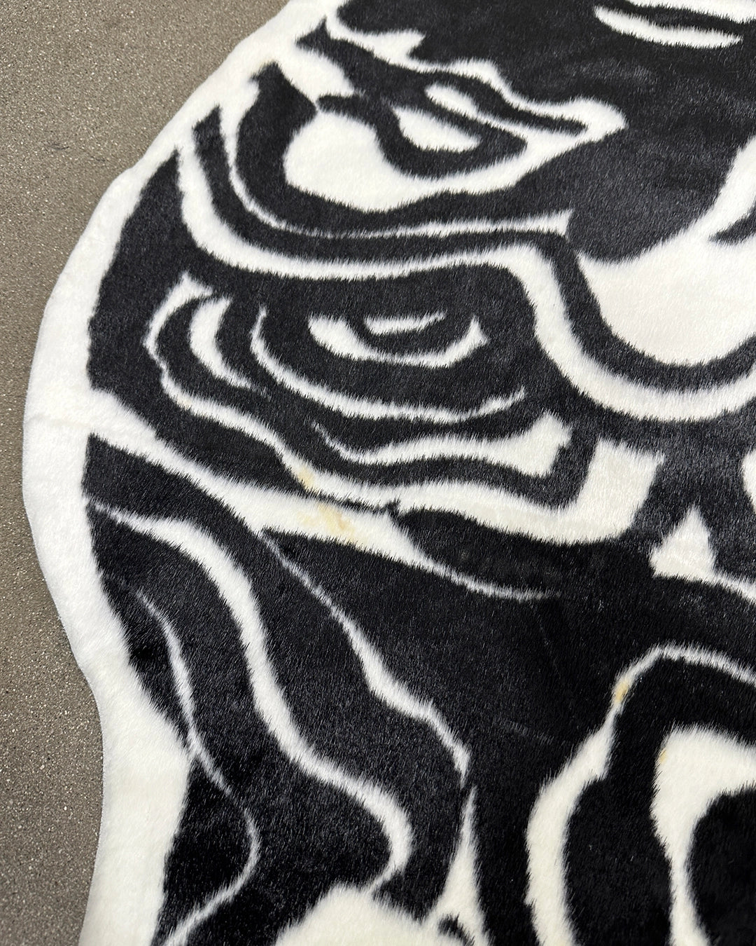 Close-up of a black and white patterned rug  