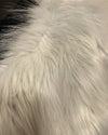 Close-up of white fake fur fabric with a soft texture