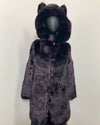 Purple fake fur coat with hood and wolf ears on a mannequin against a white background