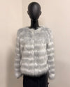 Mannequin wearing a silver and ivory plush 'striped' faux fur jacket against a plain background