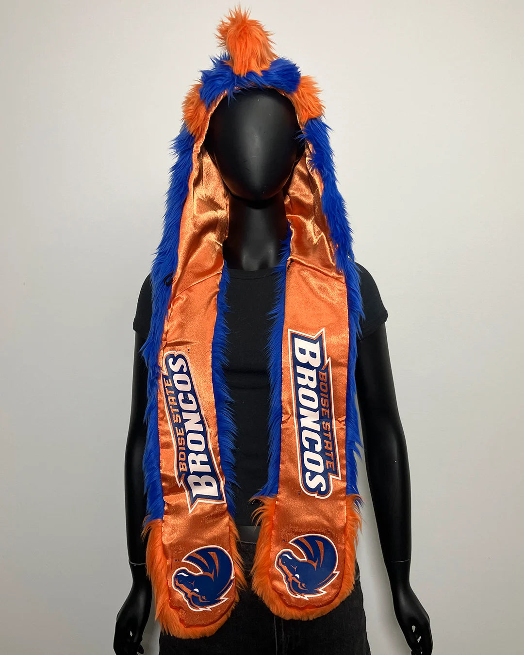 Mannequin wearing an orange and blue faux fur hood with 'Broncos' branding on a white background