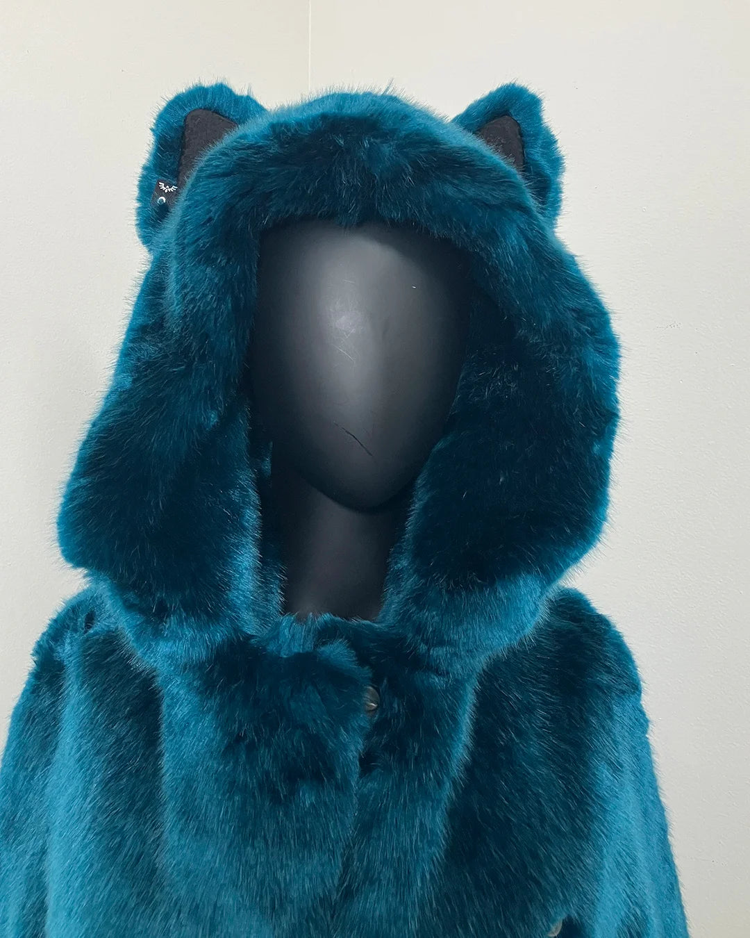 Teal faux fur coat with hood & ears on a white background. SpiritHoods Online Sample Sale Product: Classic Faux Fur Coat in Royal Wolf in XXS 