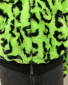 Green and black leopard print jacket with a zipper on a mannequin 