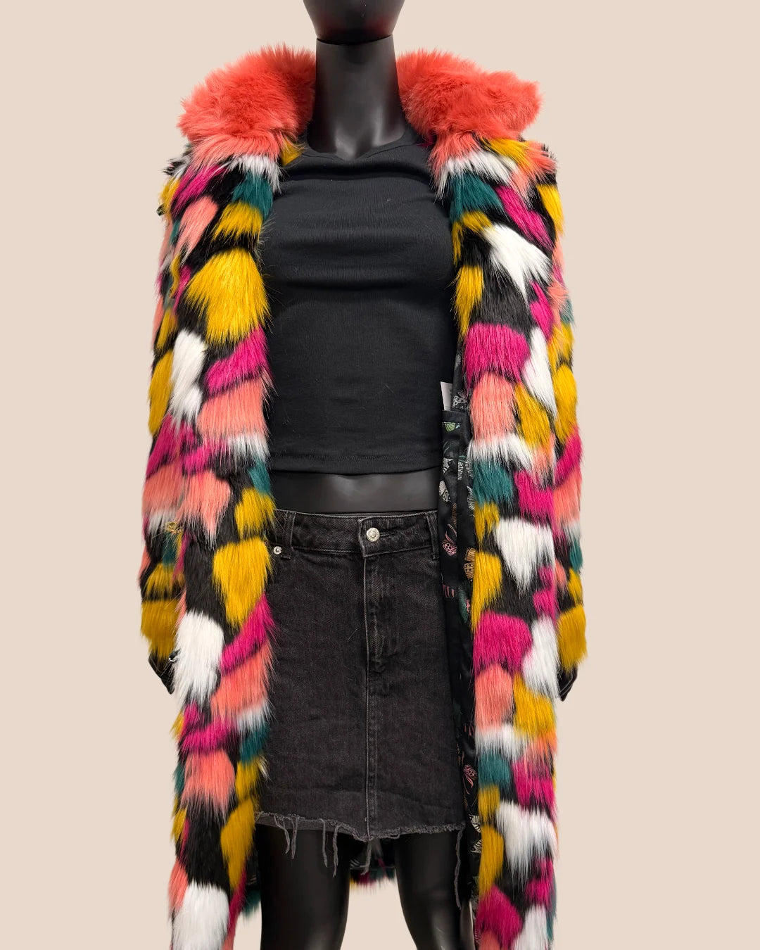 Mannequin wearing a colorful faux fur coat with a neutral background
