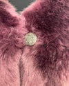 Close-up of purple/lavender plush luxury fluffy fake fur coat with a decorative button in the center.  SpiritHoods Online Sample Sale Style in Lavender Wolf in Size XXS