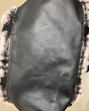 faux leather at the bottom of the faux fur duffle bag