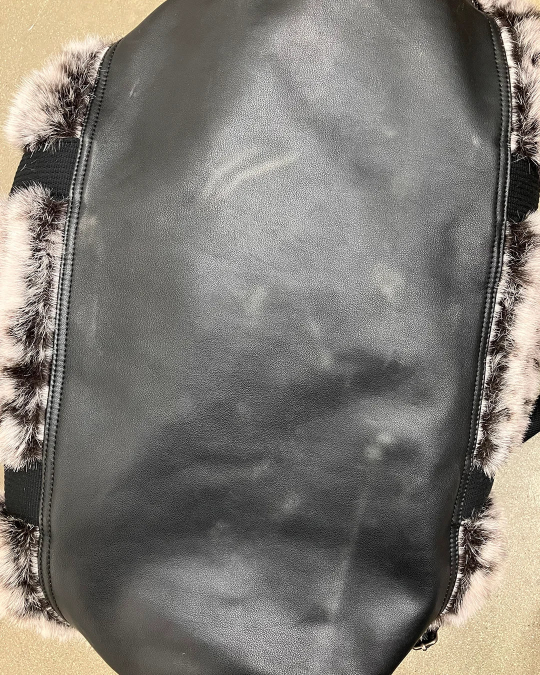 faux leather at the bottom of the faux fur duffle bag