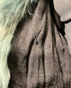 Close-up of a textured fabric with a fur-like material on the side