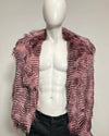 A pink and black feather-patterned faux fur jacket displayed on a white torso mannequin against a plain light gray background.