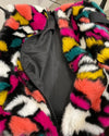 Multicolored fake fur duffle bag, with the zipper open showing the inside of the weekender bag