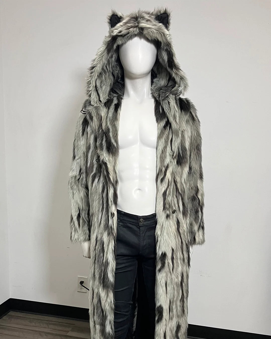 A long faux fur coat with hood and animal-ear, displayed on a white mannequin against a plain light gray background.