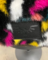 Multicolored fake fur duffle bag with a spirithoods brand logo label on a neutral background