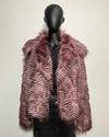 Mannequin wearing a pink/lavender fake fur jacket with a feather style bird pattern