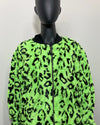 Mannequin wearing a neon green jacket with black leopard print pattern on a white background