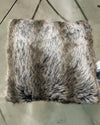 Fake Fur-patterned pillow on a concrete surface