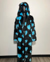 Black fur coat with blue heart patterns on a mannequin against a plain background