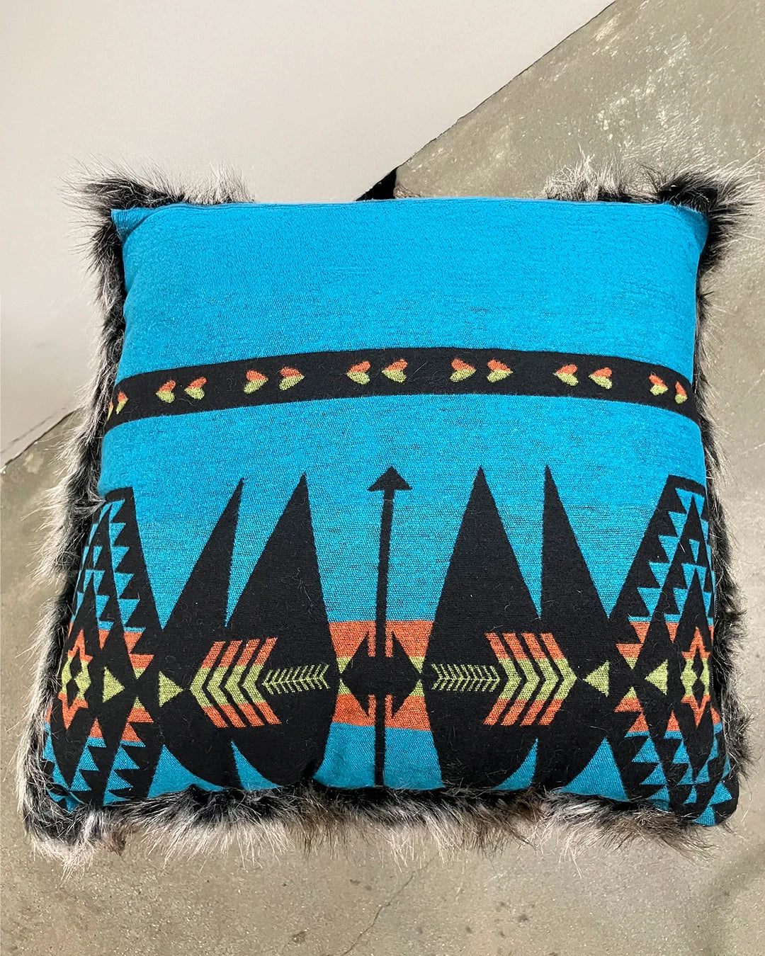 Decorative pillow with geometric pattern on a textured surface