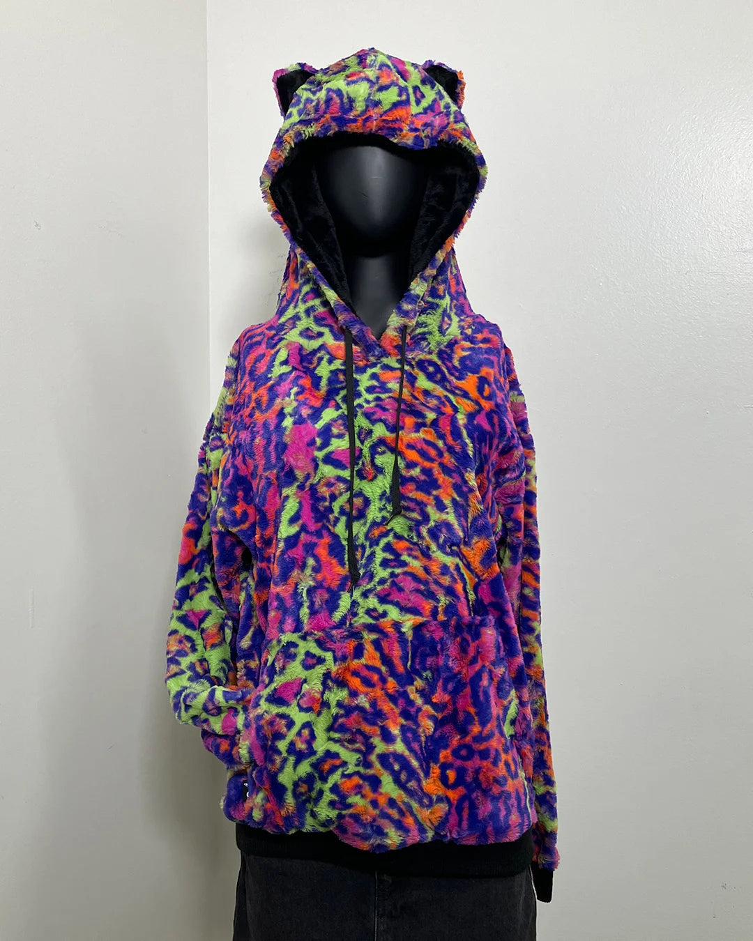 Colorful leopard print hoodie on a mannequin against a white background