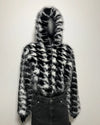 Black and white fake fur jacket on a plain background