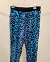 Blue leopard print pants on a beige background