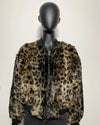 Leopard print jacket on a mannequin against a plain background