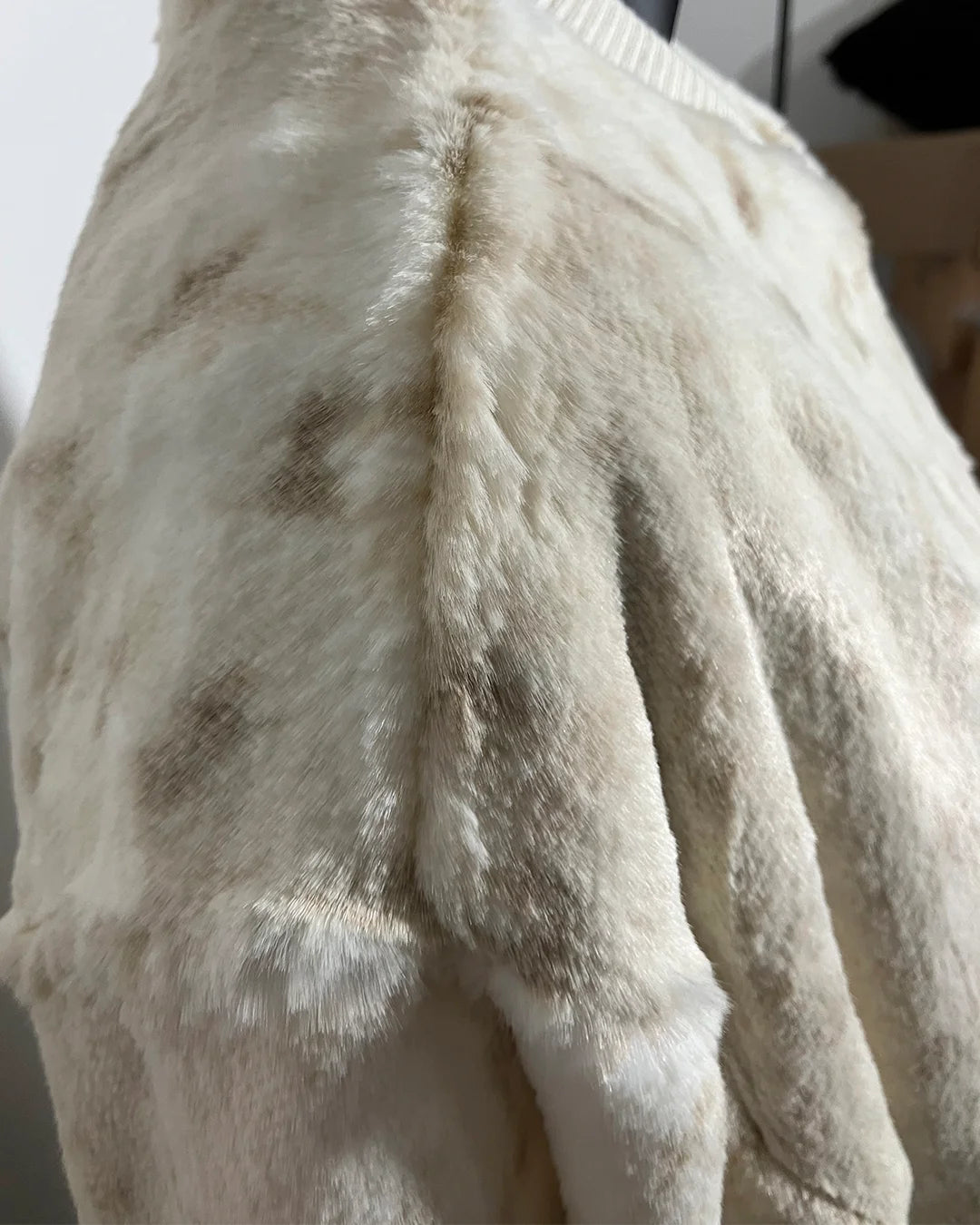 Close-up of a fake fur coat showing the seams and fake fur