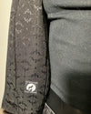 Close-up of the SpiritHoods logo liner in the Ocelot Faux Fur Bomber Jacket sample