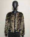 Leopard print faux fur jacket on a mannequin against a white background
