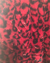 Red fabric with black leopard print pattern