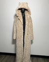 Leopard print coat on a mannequin against a plain background