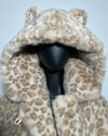 Leopard print fur coat on a mannequin against a light blue background