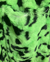 Close-up of green fabric with black leopard pattern
