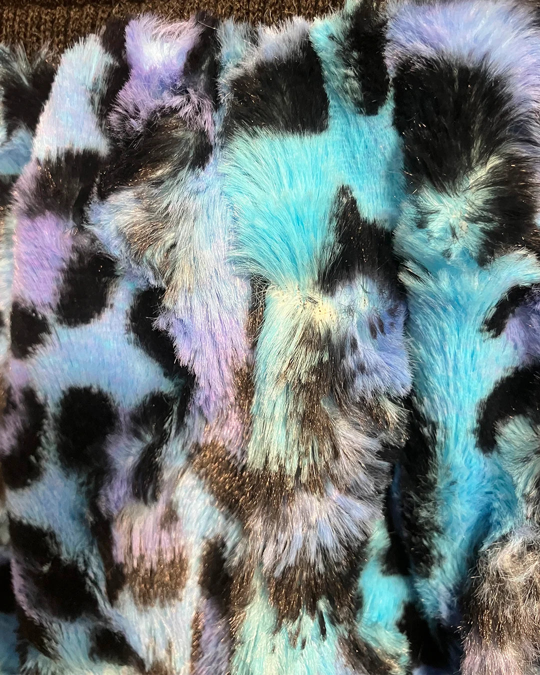 Multicolored fake fur fabric with leopard print pattern