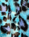 Close-up of a fabric with blue, black, purple leopard print pattern