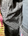 Close-up of a textured black SpiritHoods logo liner and inner zipper pocket