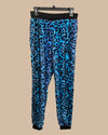 Blue leopard print lounge pants on a beige background