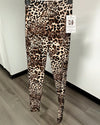 Leopard print leggings on a black hanger.