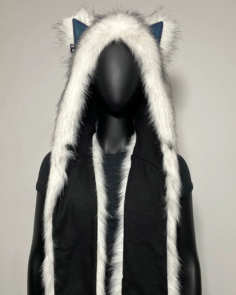 A festival hood with white faux fur trim and canine ears, displayed on a black mannequin. The hood has white Husky ears with blue inner lining, and the front has two blue paw-print pockets with purple gradient accents.
