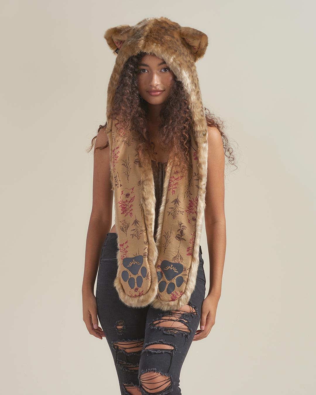 Woman wearing African Golden Cat Luxe Faux Fur Collector Edition Hood, front view 2
