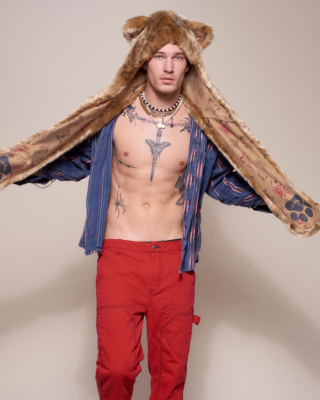 Man wearing African Golden Cat Luxe Faux Fur Collector Edition Hood, front view 6