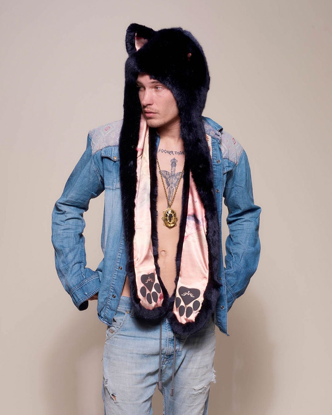 Man wearing Indigo Wolf Luxe Collector Edition Faux Fur Hood, side view 1