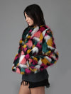 Woman wearing faux fur Butterfly Bomber Limited Edition coat, side view 1